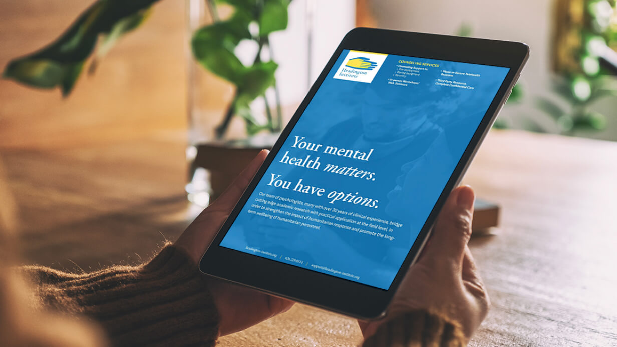 A tablet showing Headington Institute's website with the headline, "Your mental health matters."