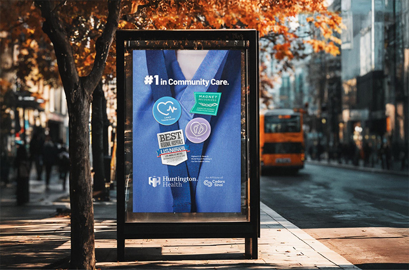 Image of bus stop poster and fall leaves